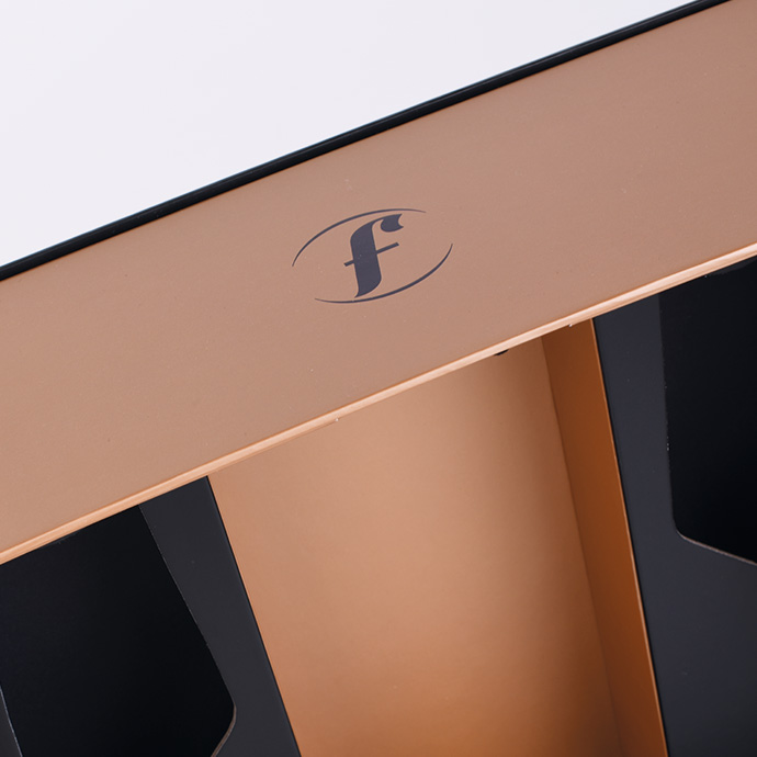 Black packaging for Filliers Distillery Genever 30 years old and print in rose gold